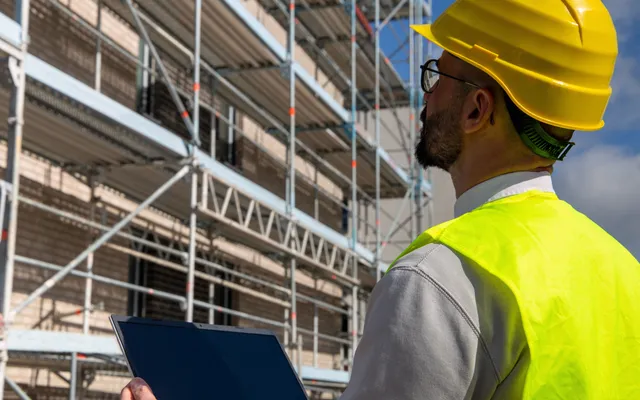 Close-up of construction work being inspected for a defect