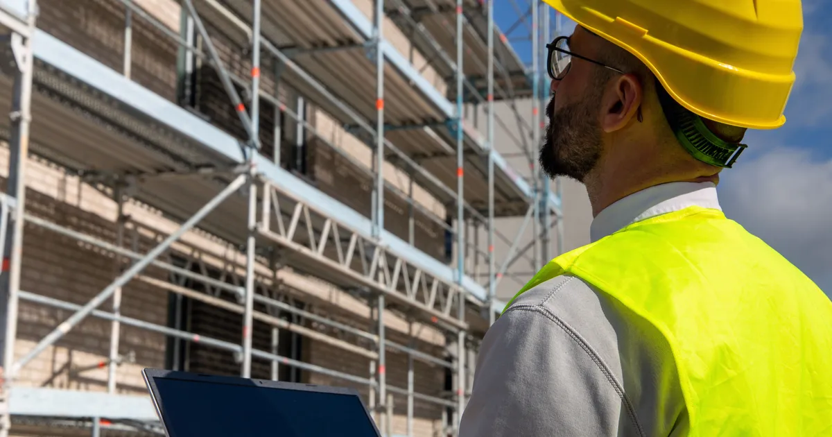 Close-up of construction work being inspected for a defect